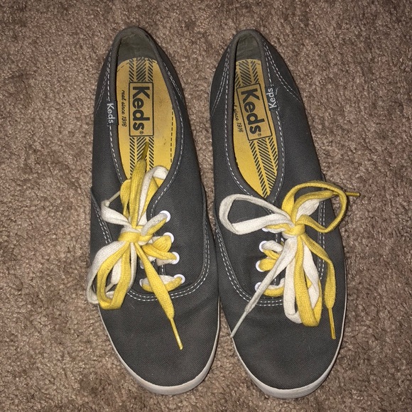 grey keds with yellow laces